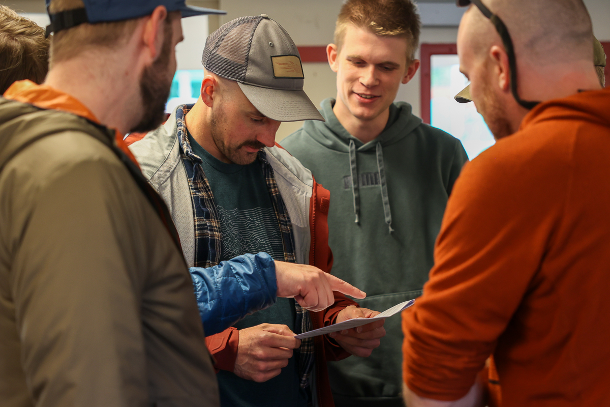 a group of people reading a paper together