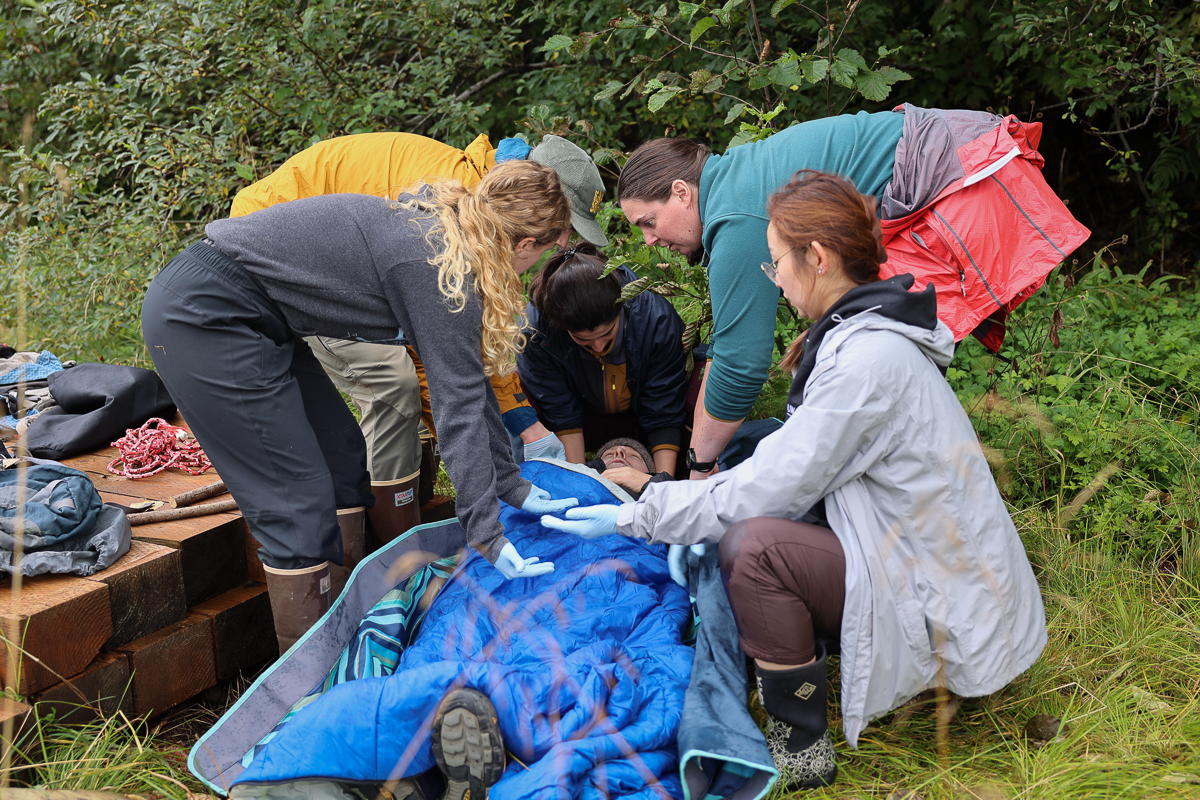 medical students treating a patient outside