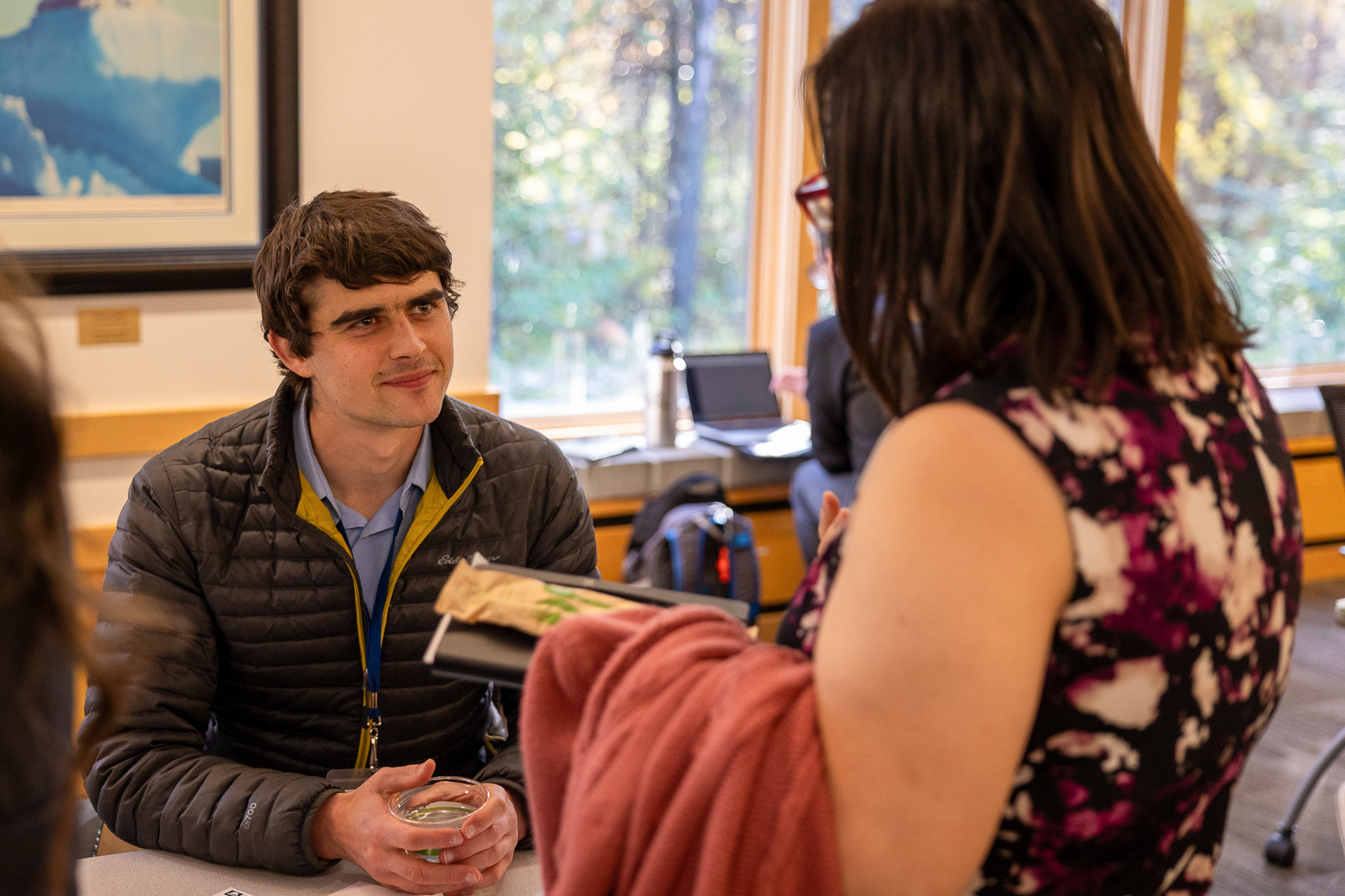Ian McCarthy smiling at an attendee
