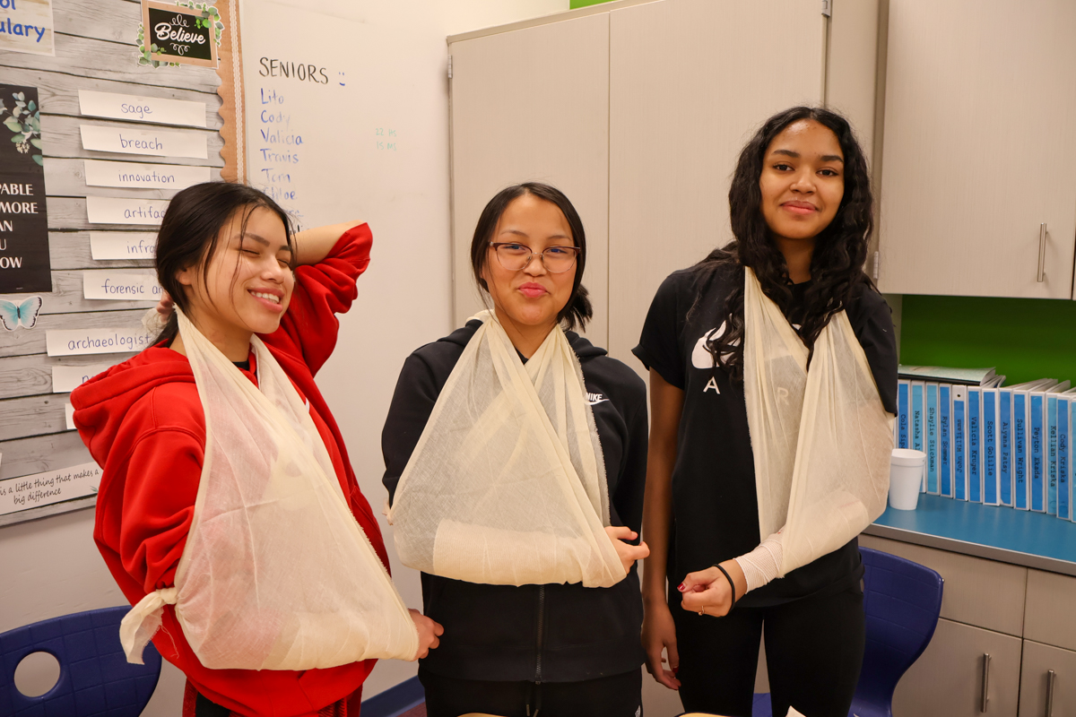 students in Nulato learn how to make a sling