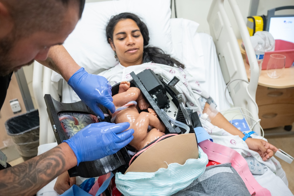 Simulation specialist prepping the device