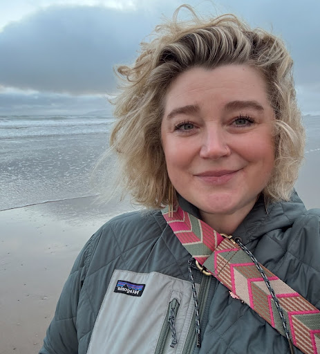 A headshot of Solveig Pedersen on a beach