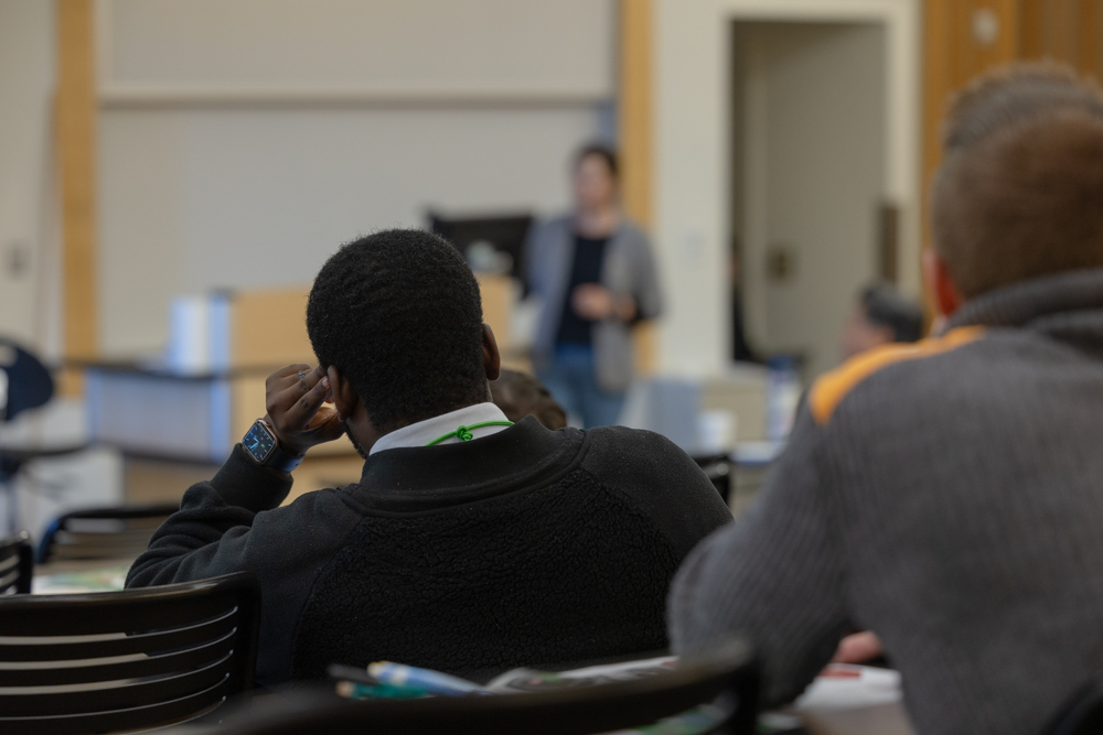 faculty with hand holding the head on a desk