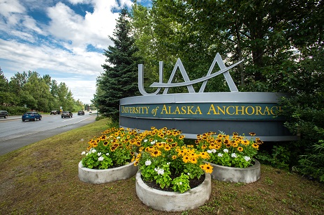 UAA sign surrounded by flowers