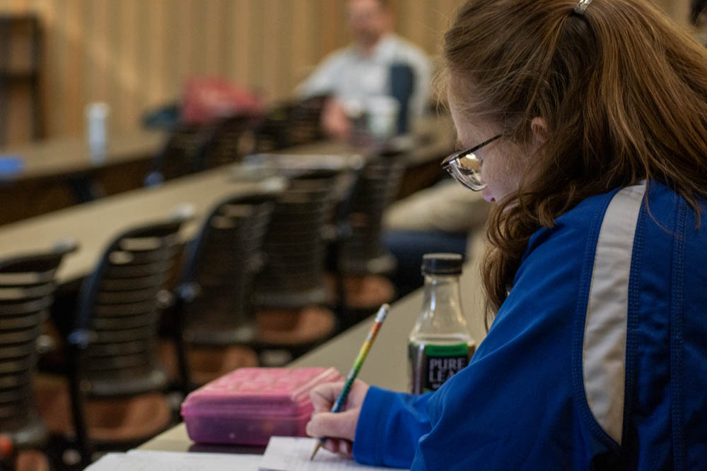 new faculty holding pencil