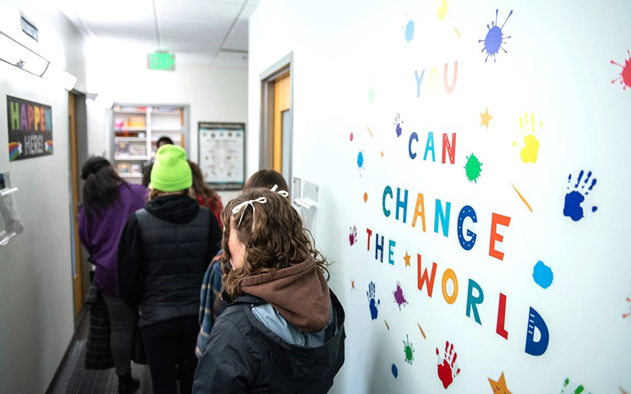 you can change the world printed on a wall