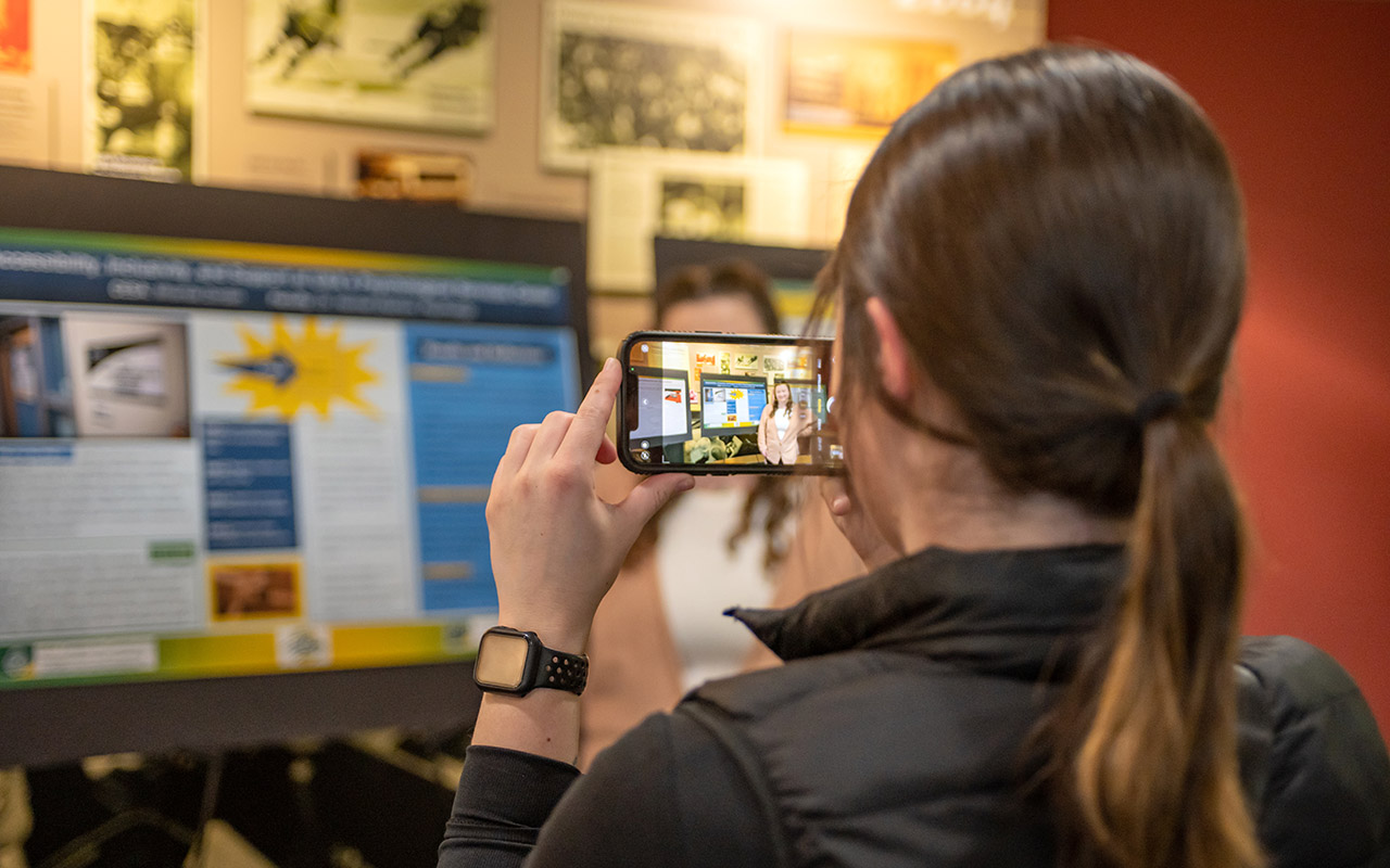 phone taking photo of a poster