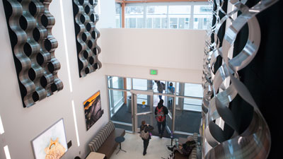 Students walking through on of the campuses science buildings