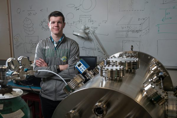 Peter Renner with an ultra-high vacuum chamber