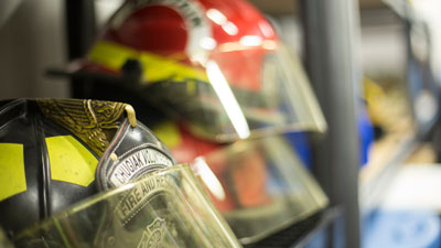 Firefighter helmets on a shelf