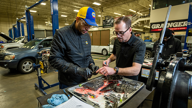 Assistant Professor of Automotive Technology Richard Hale teaching a student about how an automatic transmission works.
