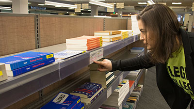 A student picking up textbooks at the bookstore