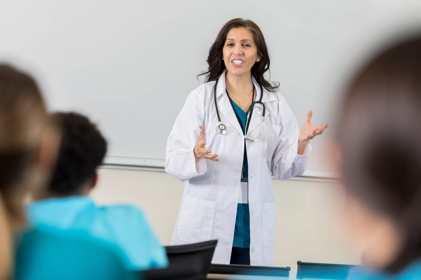 A medical professional lectures a class