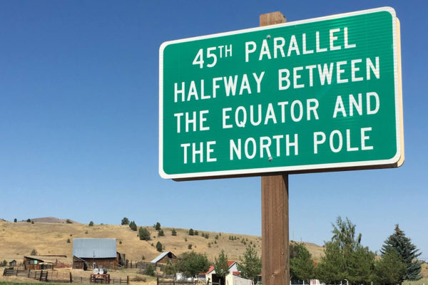 Sign reads 45th parallel - halfway between the equator and the north pole
