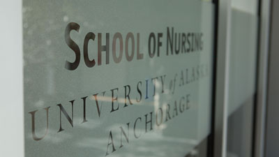 The sign on the door for the School of Nursing