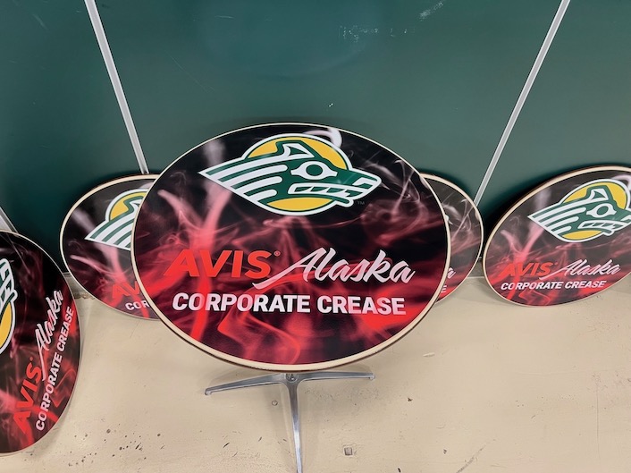 A red table graphic that includes the Seawolf logo. The table has the Avis and Alaska Airlines logo underneath the Seawolf logo. 