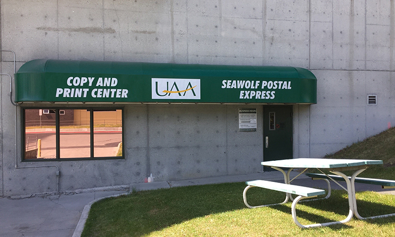 UAA copy and print center and seawolf postal express main door   