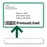 Icon of envelope with old mail markings on it and a sticker with arrow indicating to cover up the old barcode.