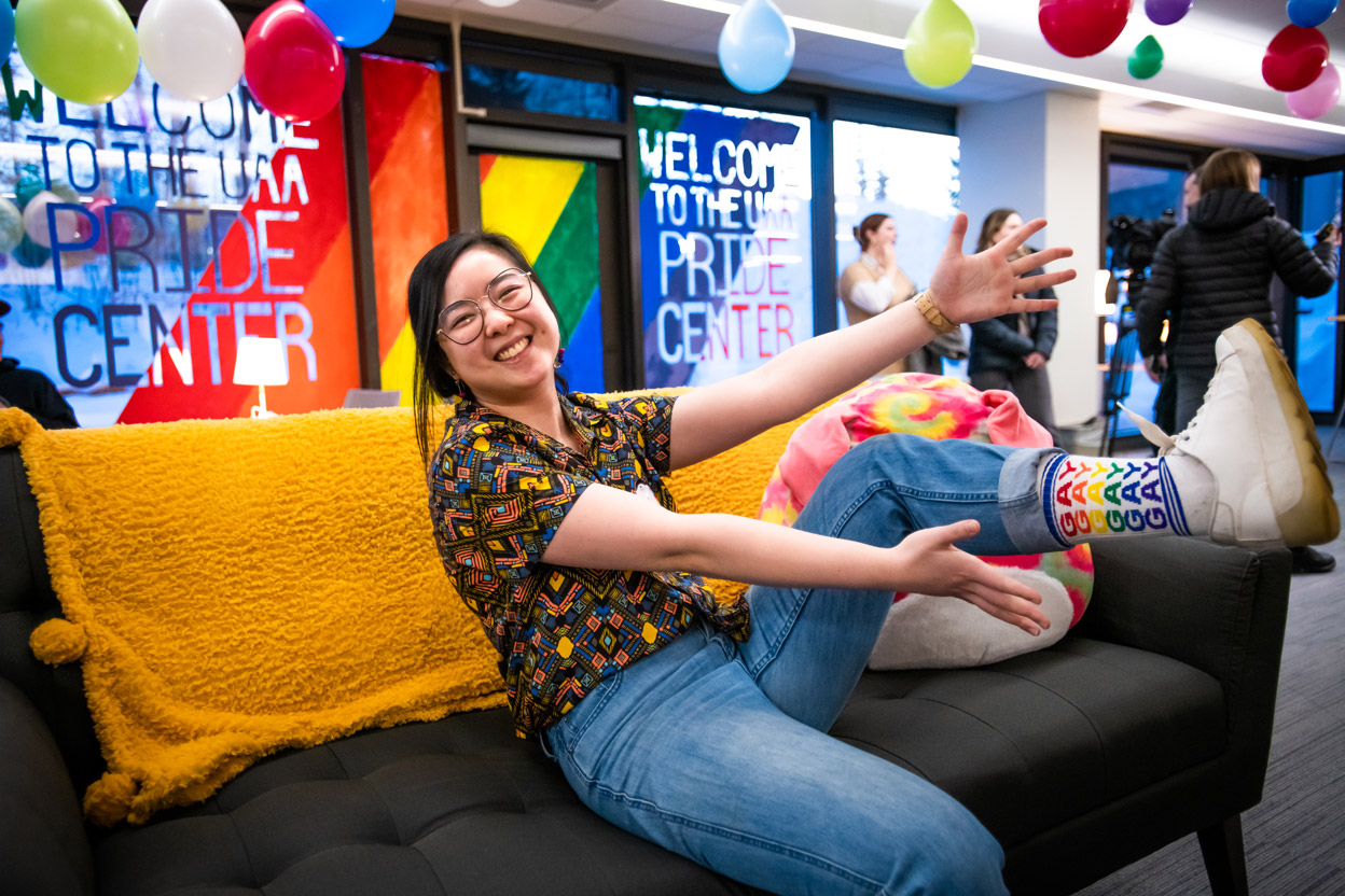 Xi Wong shows her pride while hanging out with fellow students in the new UAA Pride Center just prior to its grand opening celebration in the Student Union. (Photo by James Evans / University of Alaska Anchorage)