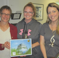 Photo of CHBRS staffers Cindy Green and Holland McMullen receiving their award office's award from Paula Williams of the Office of Sustainability