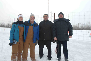 UAA master's student Lauren Caruso, Dr. Douglas Causey, Dr. Andrey Tolstikov and Dr. Andrey Soromotin at a field biology lab on moose nutrition held at the Alaska Dept. of Fish & Game moose pens facility near the  Matanuska Experiment Farm in Palmer. 