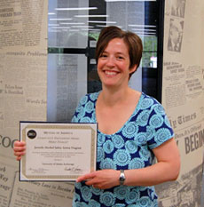 Professor Rivera holds the certificate of recognition as a community partner of the VOA Alaska Juvenile Alcohol Safety Action Program
