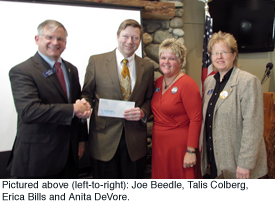 Mat-Su College Director Talis Colberg accepting the check from Northrim Bank