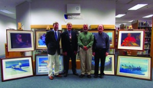 Left to right: MSC Director Talis Colberg, MVFCU Board President Don Shiesl, MVFCU CEO Al Strawn and MSC Library Director Craig Ballain in the Okeson Library with the newly donated Fred Machetanz prints.