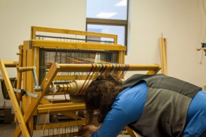 One of a dozen looms in UAA's weaving class. One of a dozen looms in UAA's weaving class.