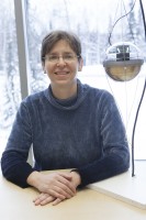 Katherine Rawlins with "Baby DOM," a model of an IceCube Digital Optical Module.