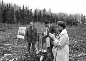 Chancellor David Outcalt (center, holding the shovel) prepares to dig the first hole for the Fine Arts Building at a groundbreaking ceremony.