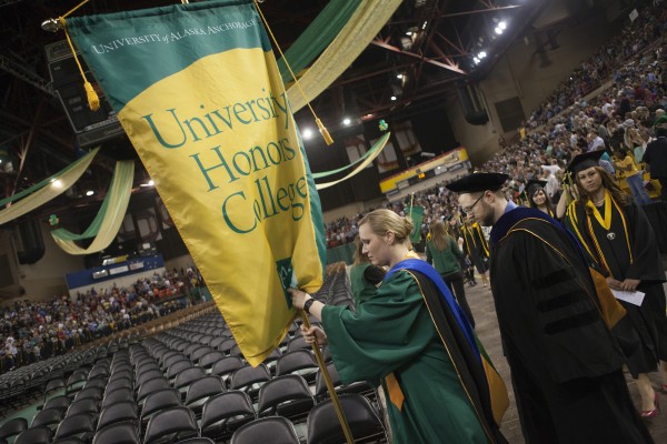 Erin Johnson (B.A. '05, MS '10 Psychology) leads the Honors College graduates into the 