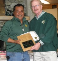 Felipe Castro receiving the 2014 Bill Rose Memorial Award from Vice Chancellor for Administrative Services Bill Spindle.