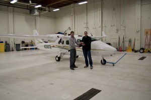 After a week-long road trip together, Graham Frye hands off the keys to the TECNAM P2006T to Ash Burrill in the UAA hangar. Photos by Andrew Gichard, Aviation Technology Division/UAA Community & Technical College.