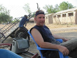 Jason Hahn, a UAA alumnus, helps drills water wells for villagers in South Sudan in his work as program director for the Alaska Sudan Medical Project. Here, he takes a break. (Photo courtesy of ASMP)