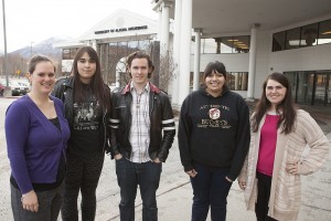 Alaska Middle College School program coordinator Whitney Tisdale and students Shana Beattie, Alex Grey, Isabel Carpenter and Yelena Sinyawski stand outside UAA's Chugiak-Eagle River Campus building, where AMCS high school classes and UAA classes take place. (Photo by Philip Hall)