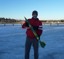 Team member John Berg, a mechanical engineering major, holds the sub-scale rocket launched in early January.