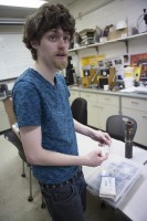 Daniel Carrick shows equipment used in radiographic materials testing, during an NDT class at UAA. (Photo by Philip Hall/UAA)