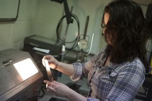 Erin Smith explains radiographic testing during a nondestructive testing class she is taking as part of an Alaska Department of Labor and Workforce Development grant program. (Photo by Philip Hall/UAA)