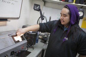 Trenton Coopchiak shows a slide of a step calibration during one of his NDT classes. (Photo by Philip Hall/UAA)