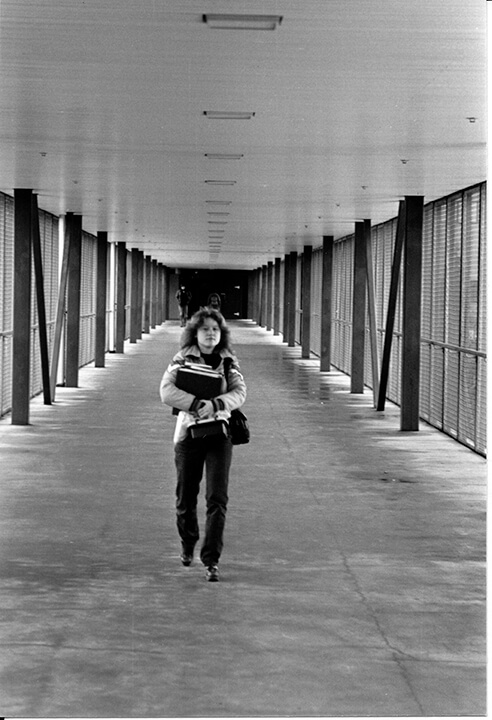 A student traverses the bridge from the Student Union to Engineering, back in the structure's cold charmless days (Photo courtesy of Archives and Special Collections, University of Alaska Anchorage).