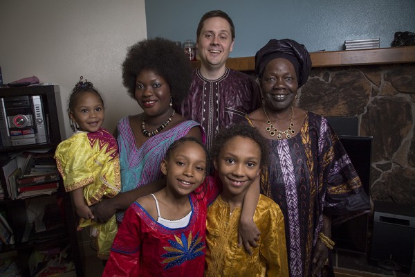 Ngone Vaught, left, learned English at Alaska Literacy Program and now works as an ALP peer language navigator. ALP is one of the organizations taking part in Friday's Urban & Rural in Alaska conference. Also pictured are Vaught's mother, Fatou Diouf, right; husband, Chris, center; and children, from left, Amanda, Kathleen and David. (Photo by Theodore Kincaid/UAA)
