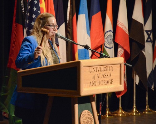 UAA student Paige Richardson, president of the General Assembly, welcomes the delegates to the opening ceremonies at this weekend's Model UN (Photo by Katie Behnke/University of Alaska Anchorage).
