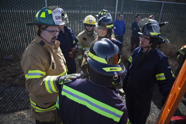 Professor Tim Benningfield talks his students through the extrication process (Photo by Philip Hall/University of Alaska Anchorage). 