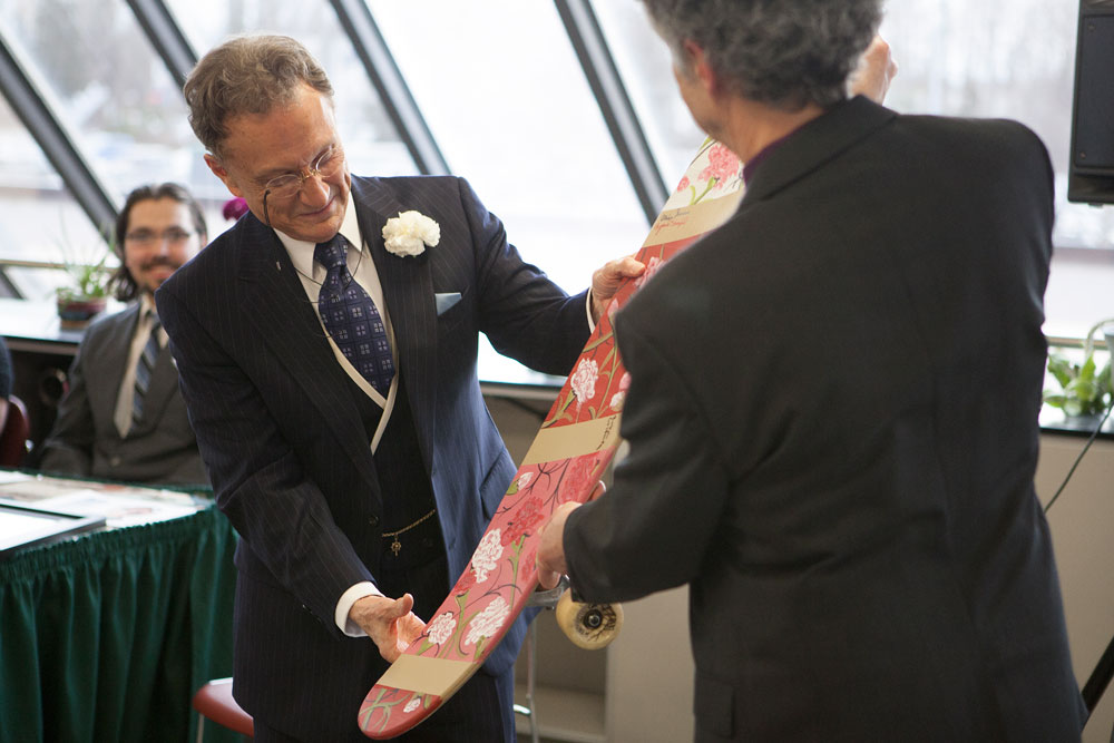 Nunnally accepts his carnation-infested skateboard