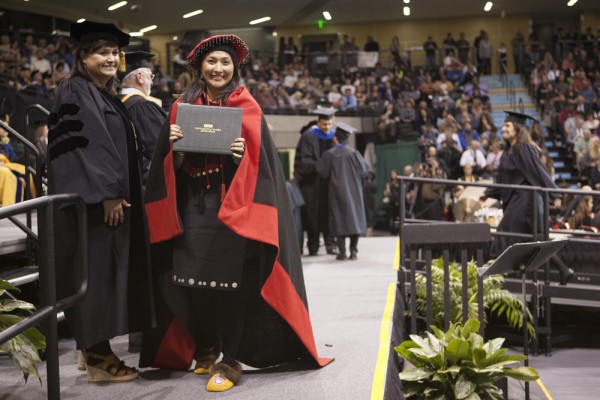 Crystalyn Lemieux celebrates after graduating in May. (Photo by Philip Hall/UAA)
