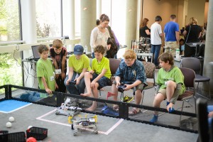 Boys in the UAA summer engineering academy work with their robots after taking part in the robotics academy session. (Photo by Tracy Kalytiak/UAA)