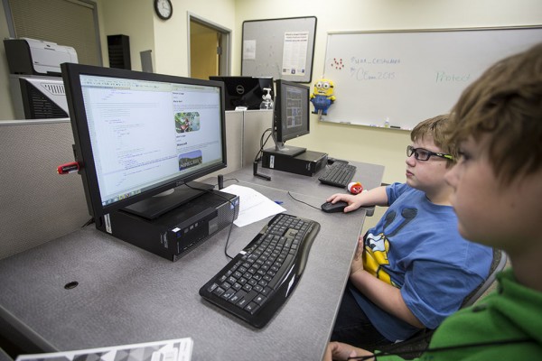 Alex Lehman, left, and Simon Mitchell work on one of their projects during the creative coding class at UAA Continuing Education's Kids College. (Photo by Theodore Kincaid/UAA)