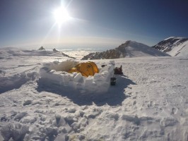 At each camp, the team built snow walls around their tents to block the wind. This is the view from 17,000 feet (Photo courtesy of Nick Brunger).