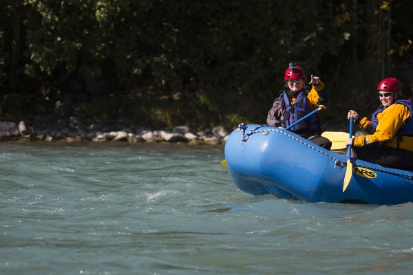 Outdoor Leadership student Monica ___ rides a wave train down the Kenai River with her beginning river rafting classmates (Photo by Philip Hall / University of Alaska Anchorage)